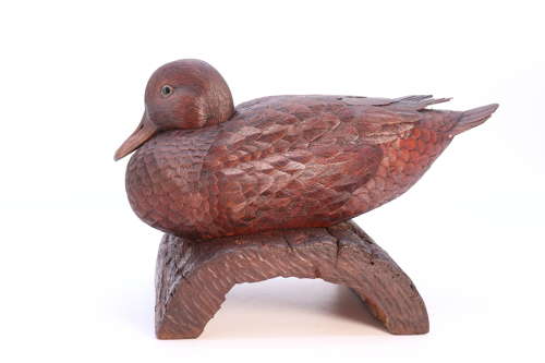 A Black Forest linden wood study of a perched mallard duck