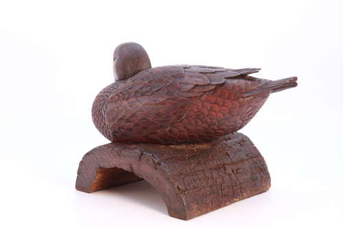 A Black Forest linden wood study of a perched mallard duck