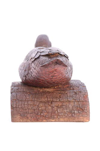 A Black Forest linden wood study of a perched mallard duck