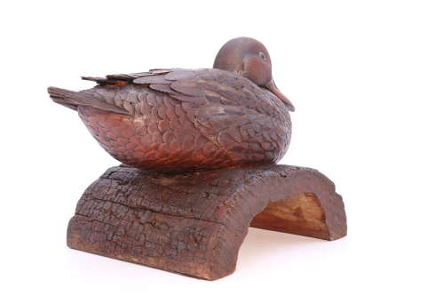 A Black Forest linden wood study of a perched mallard duck
