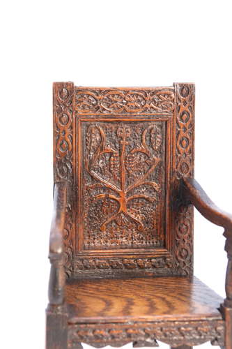A miniature country oak panelled and carved wainscot armchair, C1900
