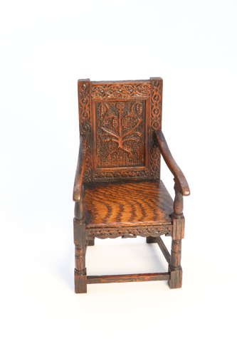 A miniature country oak panelled and carved wainscot armchair, C1900