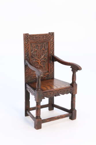 A miniature country oak panelled and carved wainscot armchair, C1900