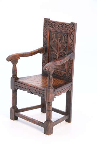 A miniature country oak panelled and carved wainscot armchair, C1900