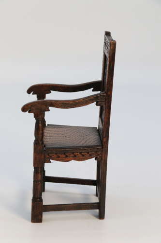 A miniature country oak panelled and carved wainscot armchair, C1900