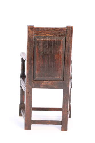 A miniature country oak panelled and carved wainscot armchair, C1900