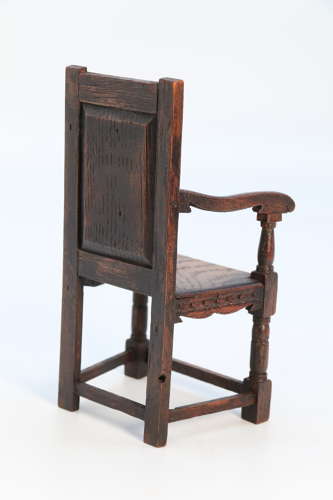 A miniature country oak panelled and carved wainscot armchair, C1900