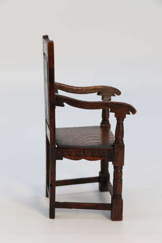A miniature country oak panelled and carved wainscot armchair, C1900