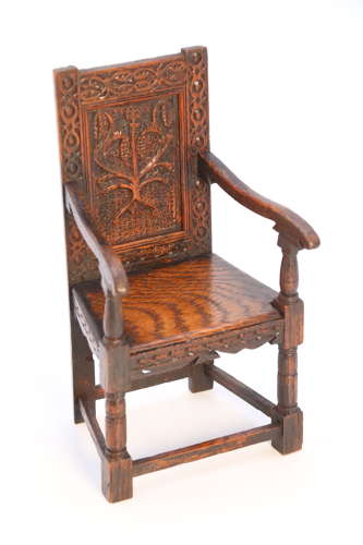 A miniature country oak panelled and carved wainscot armchair, C1900