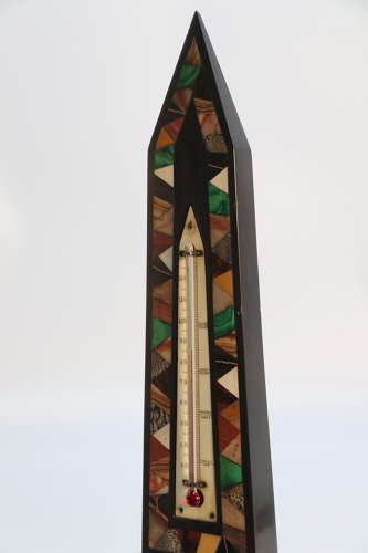 A Derbyshire black slate and specimen marbles obelisk with thermometer