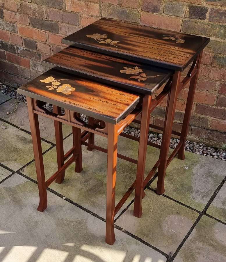 A nest of three Japanese hardwood and lacquer nest of tables c 1910