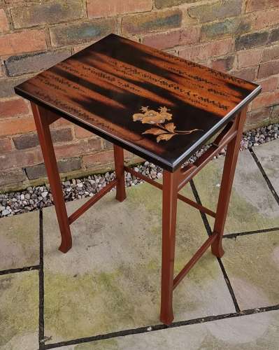 A nest of three Japanese hardwood and lacquer nest of tables c 1910