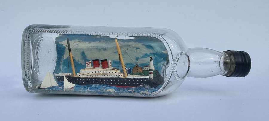 A folk art diorama model ship in a bottle, English circa 1930