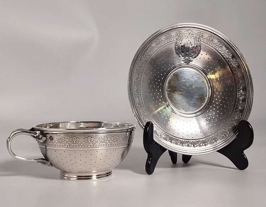 An antique French silver tea or coffee cup and saucer circa 1860