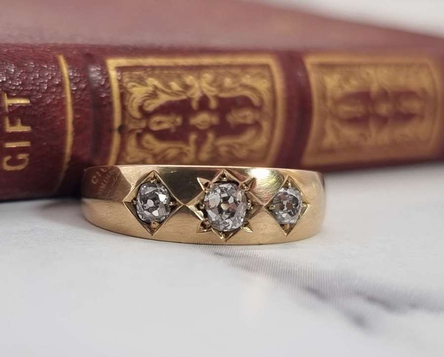 A Victorian heavy 18ct gold and diamond three stone ring.