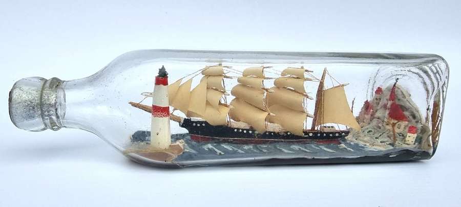 A four mast 18th century ship in a bottle, English folk art.