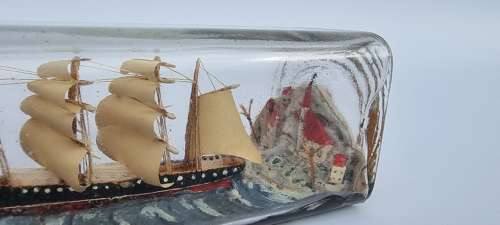 A four mast 18th century ship in a bottle, English folk art.