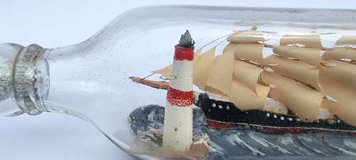 A four mast 18th century ship in a bottle, English folk art.