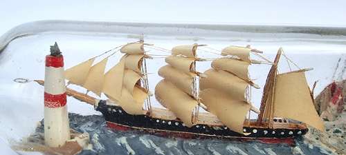 A four mast 18th century ship in a bottle, English folk art.