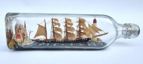 A four mast 18th century ship in a bottle, English folk art.