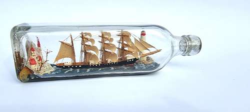 A four mast 18th century ship in a bottle, English folk art.