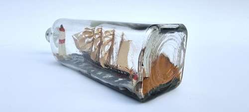 A four mast 18th century ship in a bottle, English folk art.