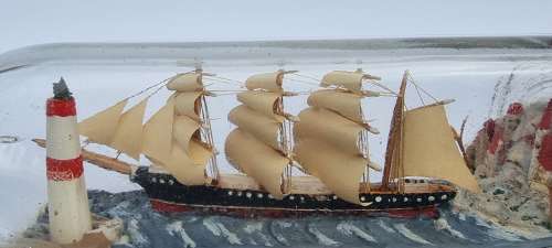 A four mast 18th century ship in a bottle, English folk art.