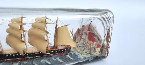 A four mast 18th century ship in a bottle, English folk art.