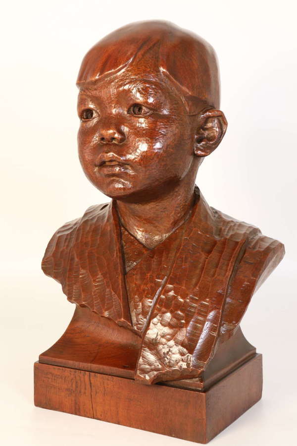 Early 20th century walnut bust of a boy by George Henry Paulin
