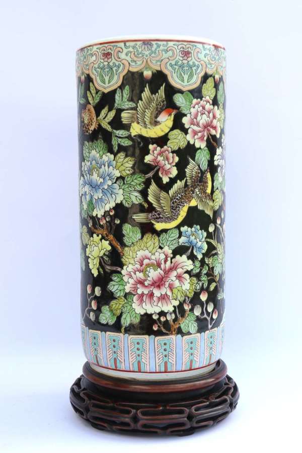 Chinese famille noire porcelain vase and original hardwood stand.