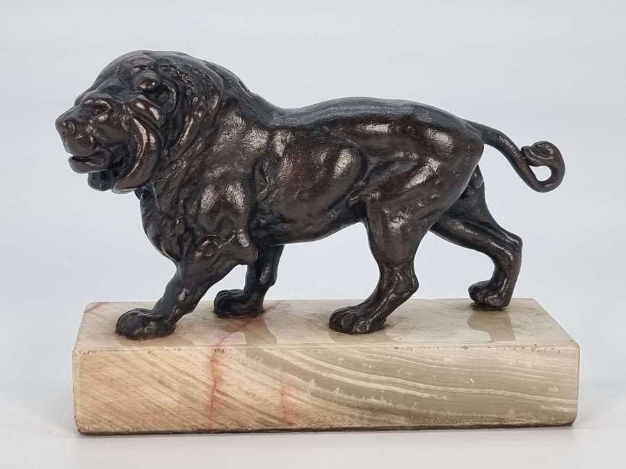 A French late 19th century bronze study of a prowling lion