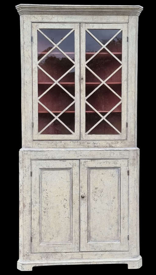 An 18th C country house painted glazed cabinet for a corner position.