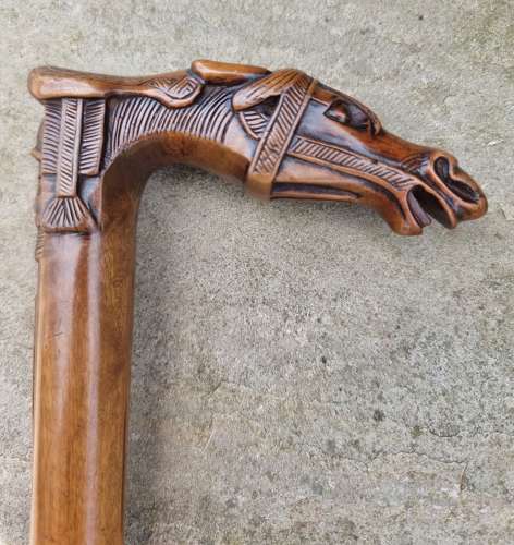 19th century olivewood walking stick with a equestrian carved handle
