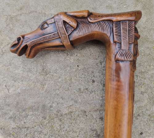 19th century olivewood walking stick with a equestrian carved handle