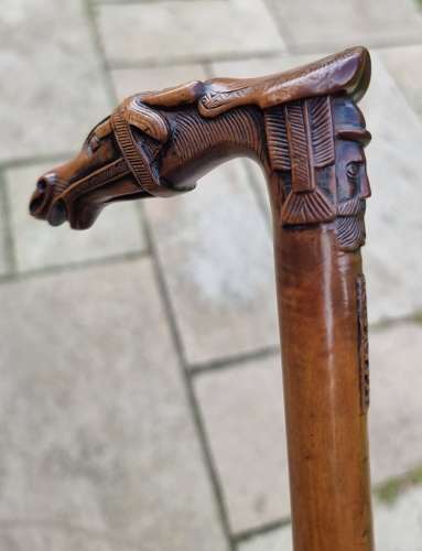 19th century olivewood walking stick with a equestrian carved handle