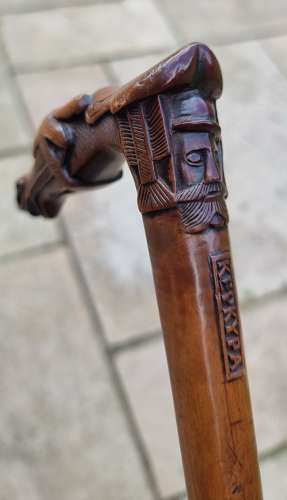 19th century olivewood walking stick with a equestrian carved handle