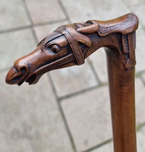 19th century olivewood walking stick with a equestrian carved handle