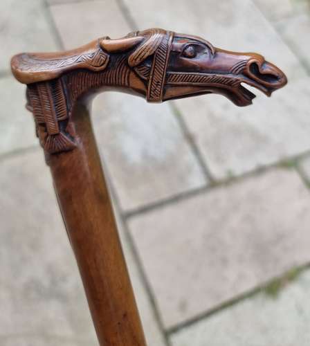 19th century olivewood walking stick with a equestrian carved handle