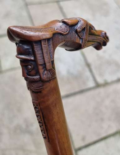 19th century olivewood walking stick with a equestrian carved handle