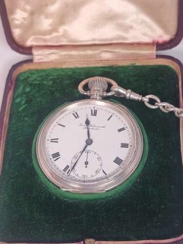 A solid silver pocket watch, presentation case and chain with two fobs