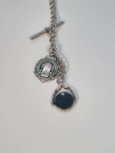 A solid silver pocket watch, presentation case and chain with two fobs