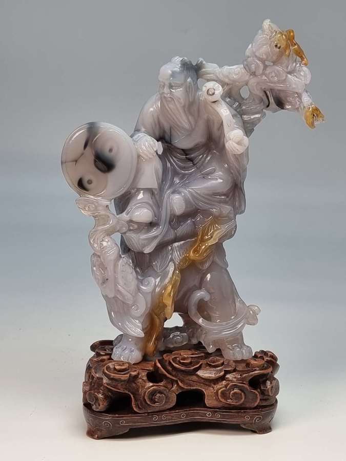 Chinese hand carved agate hardstone figure group on a hardwood stand