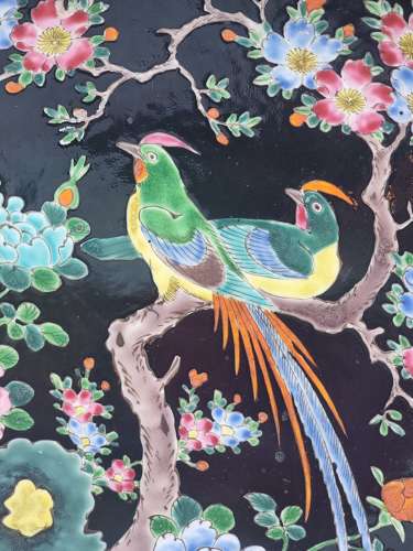 A large Chinese wall charger in famille noire porcelain