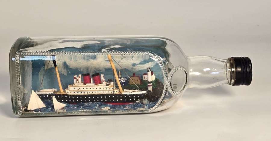 Diorama ship in bottle with yachts and a lighthouse, circa 1930