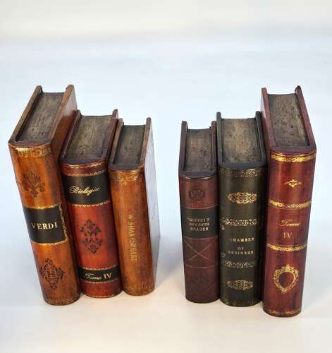 A pair of bookends made in the form of antique leather bound books.