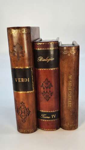 A pair of bookends made in the form of antique leather bound books.