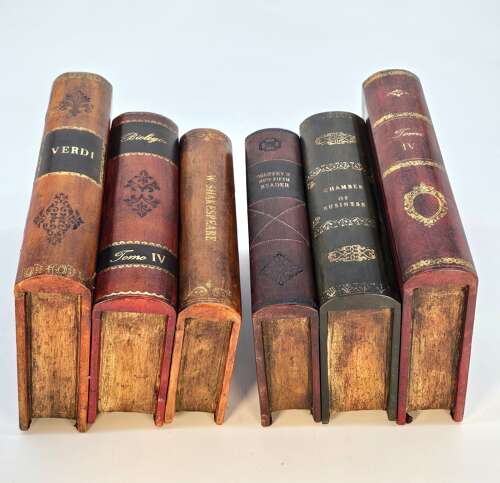 A pair of bookends made in the form of antique leather bound books.