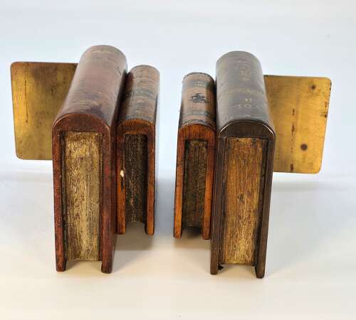A pair of bookends made in the form of antique leather bound books.