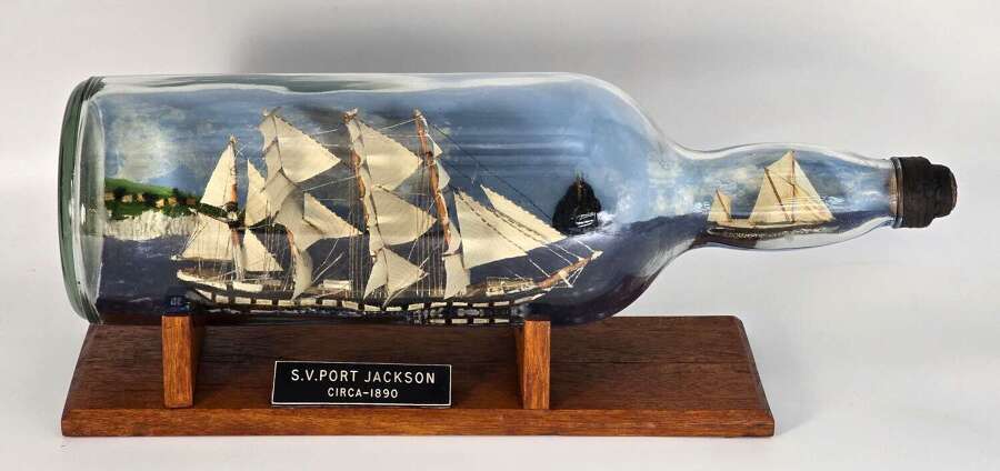A large folk art diorama double ship in a bottle circa 1920