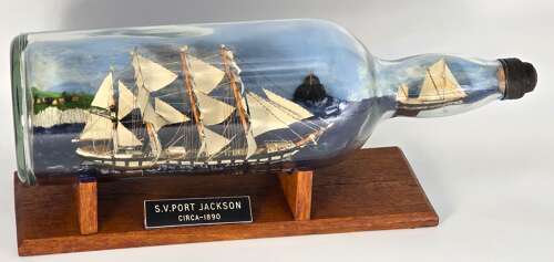 A large folk art diorama double ship in a bottle circa 1920